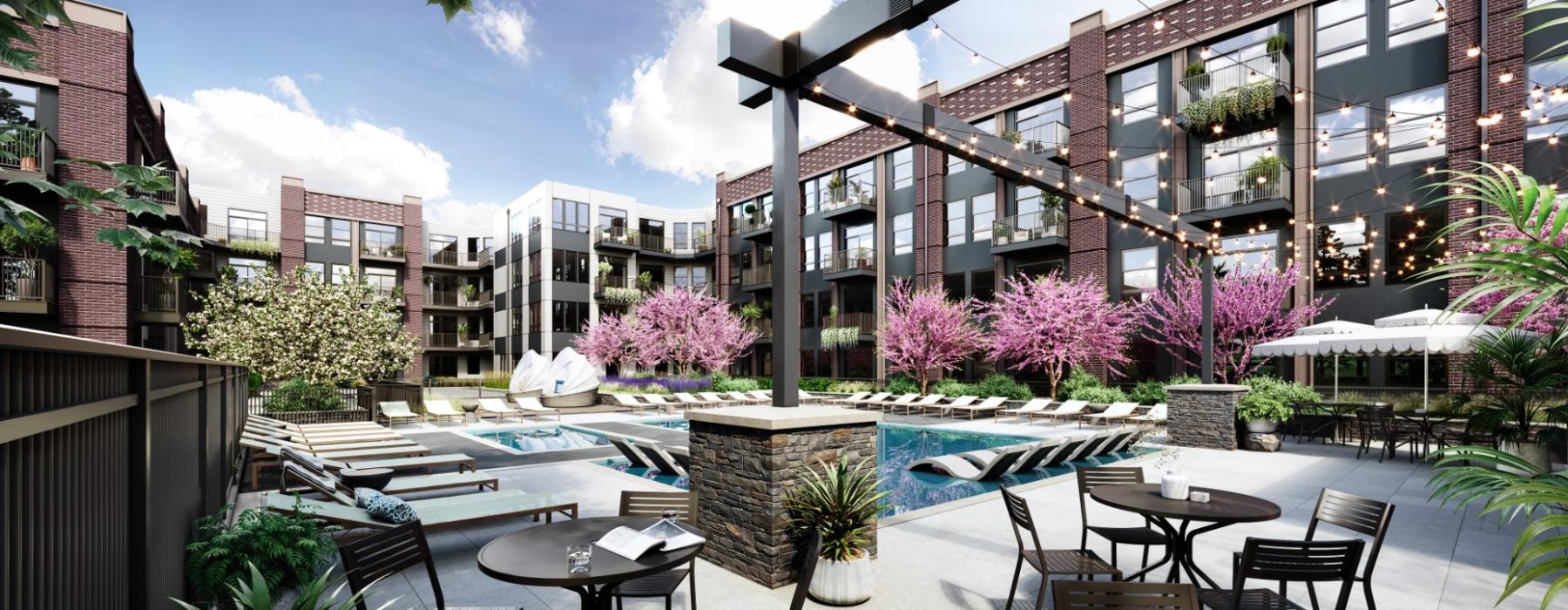 a courtyard with tables and chairs and a pool